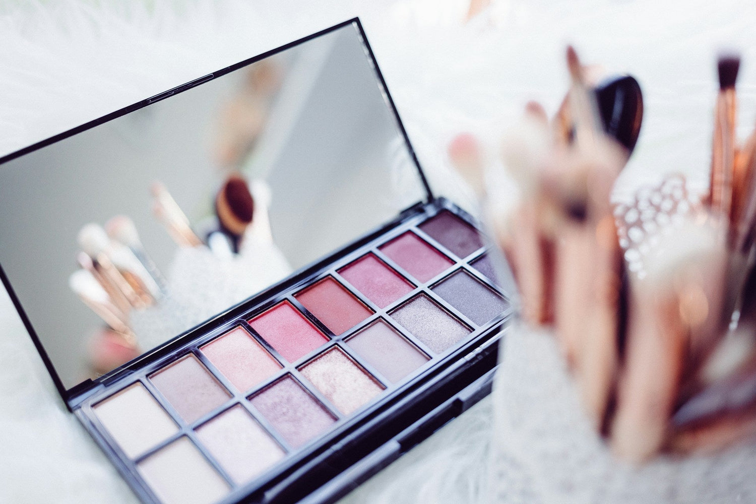 Makeup-palette-with-eyeshadow-blush-and-contour-shades-for-versatile-looks.